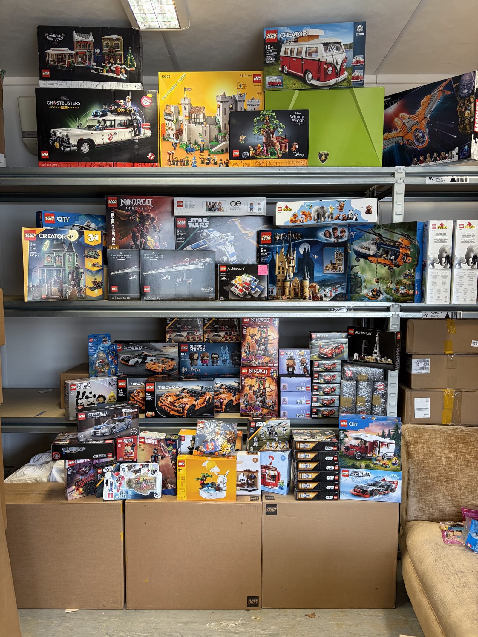 Shelves of sealed LEGO sets on the racking at the BuyMyBricks unit